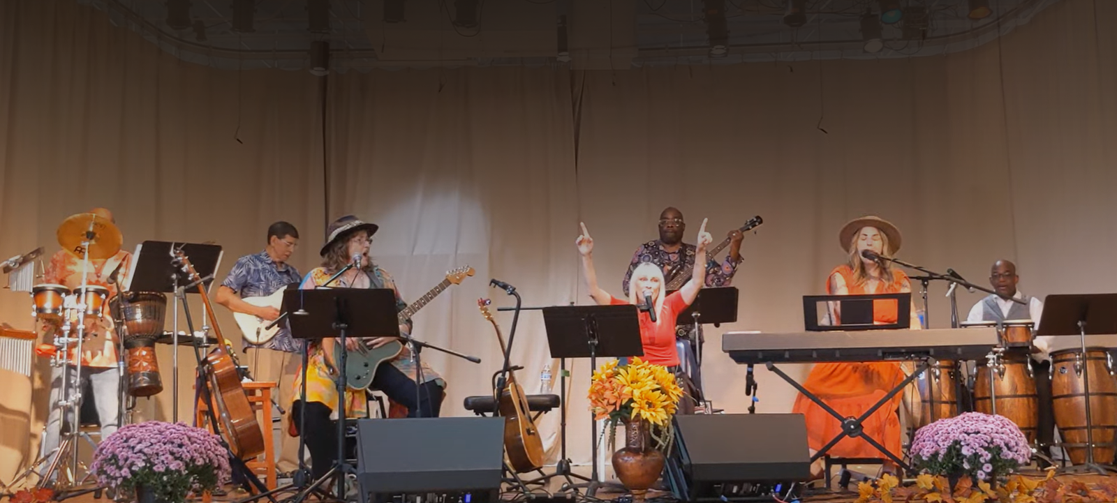 Singers and CeleStiaL Band on the stage giving music performance